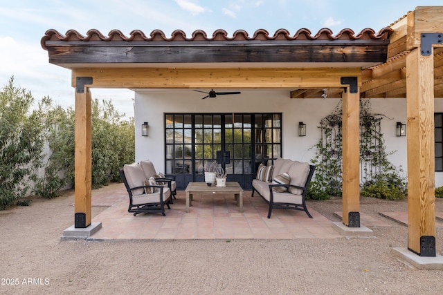 view of patio / terrace featuring ceiling fan