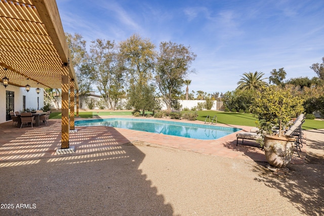 view of pool featuring a patio and a lawn