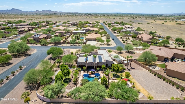 birds eye view of property with a mountain view