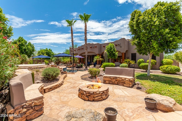 view of patio / terrace with a fire pit