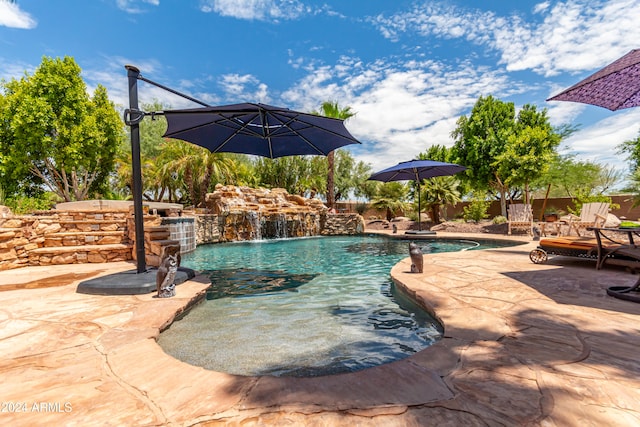 view of swimming pool with a patio area and pool water feature