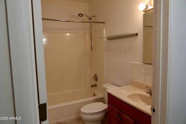 full bathroom with shower / bathing tub combination, toilet, vanity, and tasteful backsplash