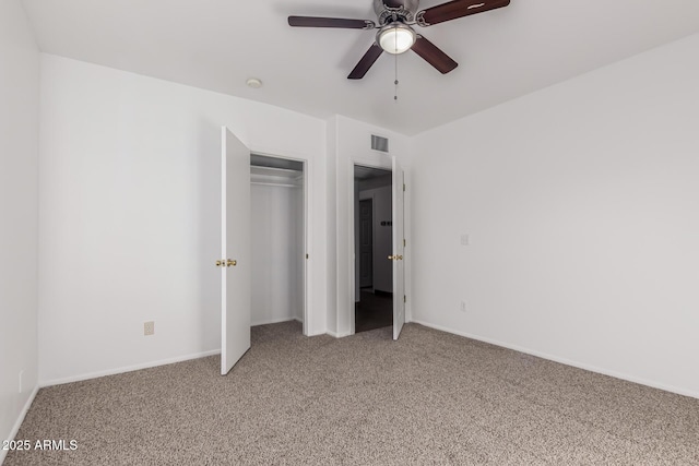 unfurnished bedroom featuring a closet, ceiling fan, and carpet floors