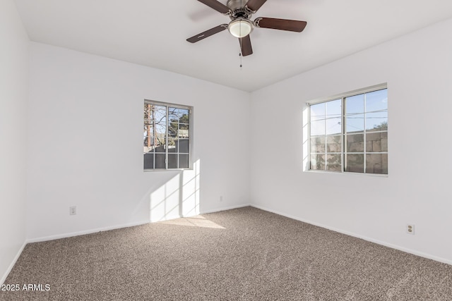 carpeted empty room with ceiling fan