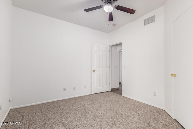 empty room featuring ceiling fan and carpet flooring