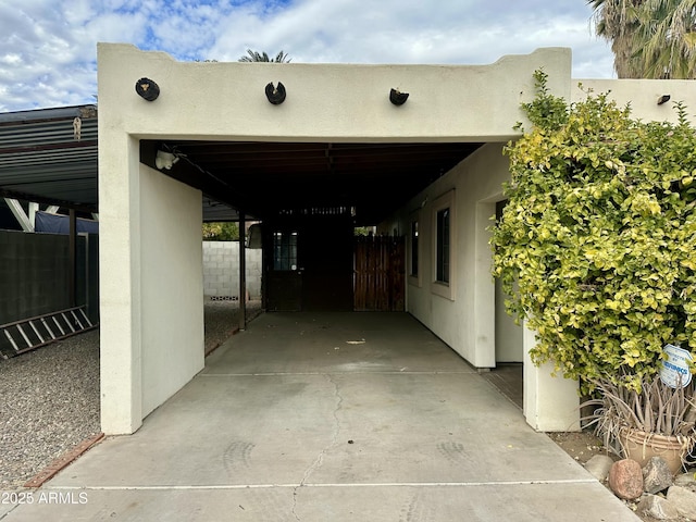 view of vehicle parking with a carport