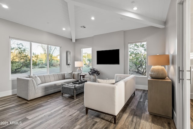 living room with wood-type flooring, vaulted ceiling with beams, and a wealth of natural light