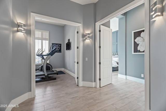 workout area featuring light hardwood / wood-style flooring