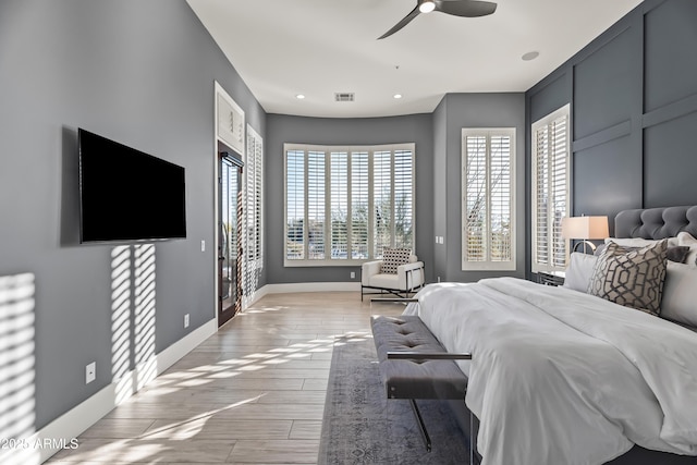 bedroom featuring access to outside, ceiling fan, and light wood-type flooring