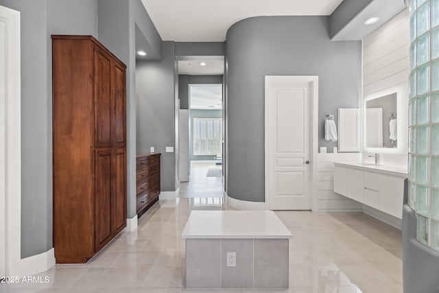 bathroom featuring tile patterned floors and vanity