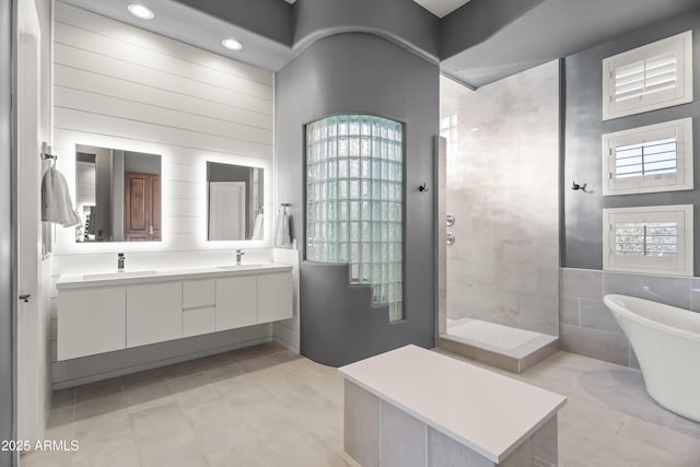 bathroom with vanity, tile patterned floors, and separate shower and tub