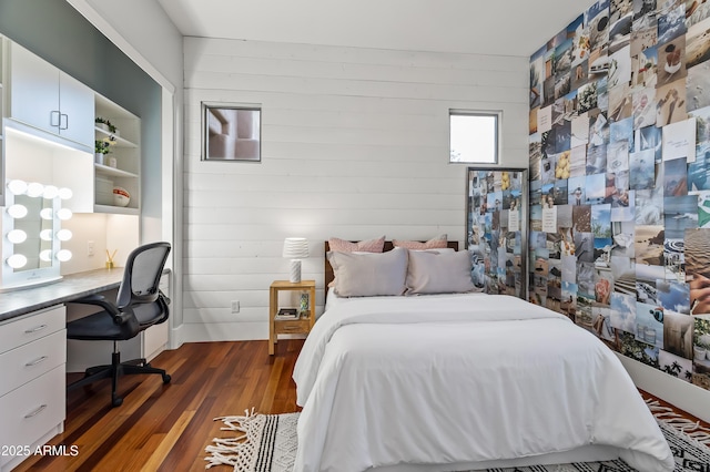 bedroom featuring dark hardwood / wood-style flooring