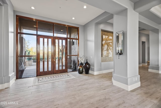 foyer with french doors and light wood-type flooring