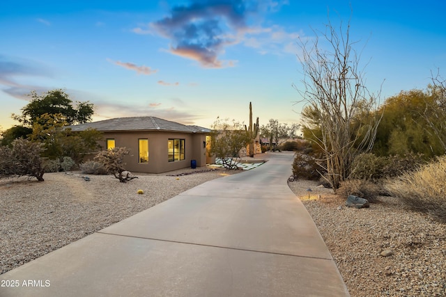 view of property exterior at dusk