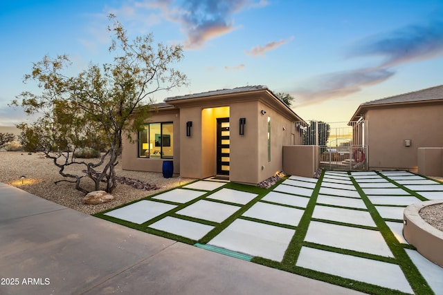 prairie-style home featuring a patio area