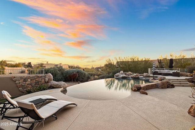 patio terrace at dusk with outdoor lounge area