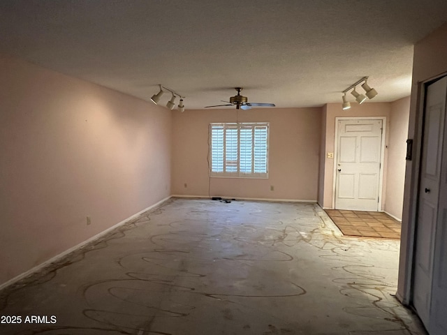 8063 N 31st Ln, Phoenix, AZ 85051 - empty room with track lighting and a ceiling fan
