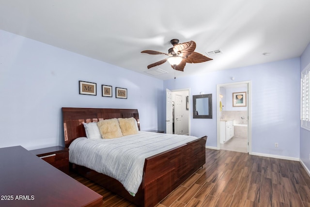 bedroom featuring ensuite bathroom, ceiling fan, and dark hardwood / wood-style floors