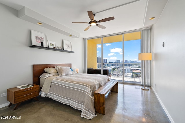 bedroom featuring expansive windows, access to exterior, and ceiling fan