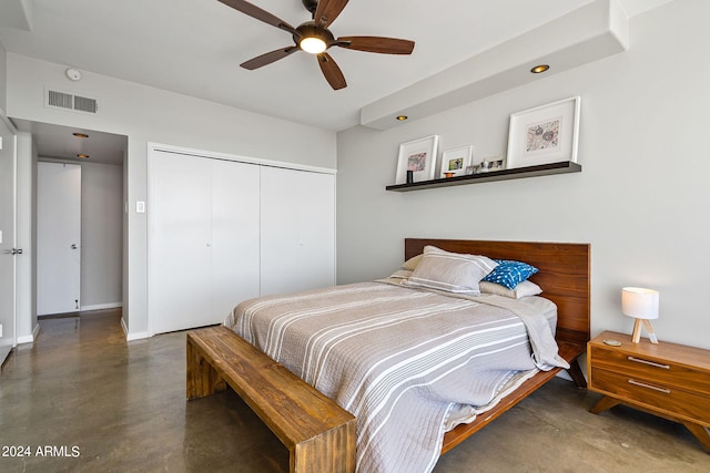 bedroom with ceiling fan and a closet