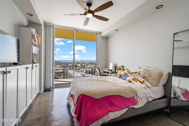 bedroom with a wall of windows, concrete flooring, ceiling fan, and access to outside