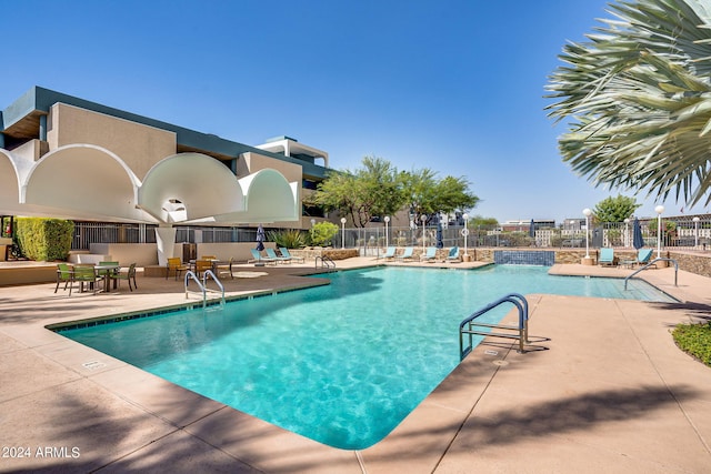 view of swimming pool featuring a patio area