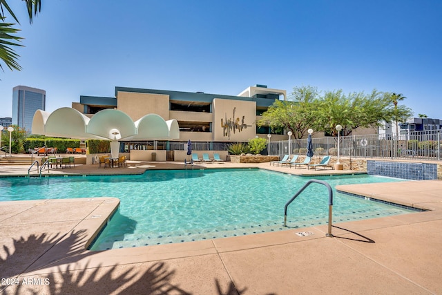 view of pool featuring pool water feature and a patio area