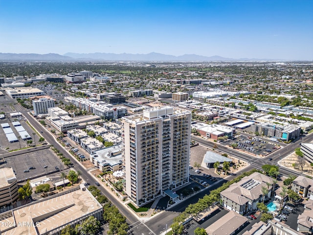 birds eye view of property with a mountain view