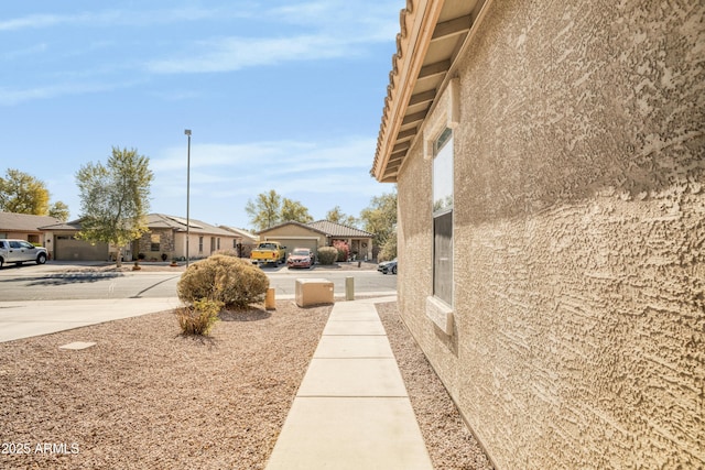 view of side of property featuring a garage