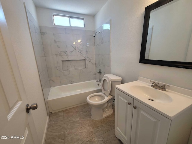 bathroom featuring toilet, shower / tub combination, and vanity