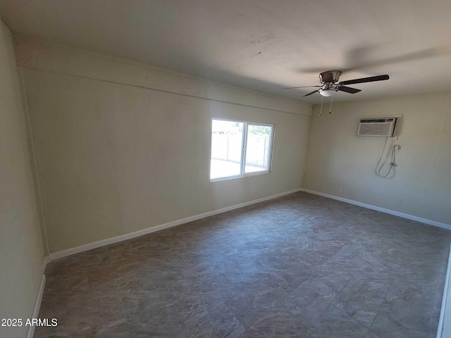 spare room featuring a ceiling fan, baseboards, and a wall mounted AC