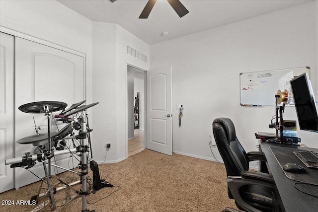 carpeted office with ceiling fan