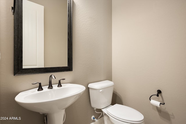 bathroom with toilet and sink