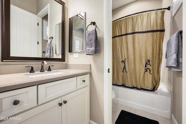 full bathroom with tile patterned flooring, vanity, toilet, and shower / tub combo with curtain