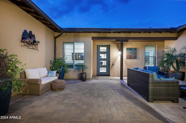 patio terrace at dusk with an outdoor living space