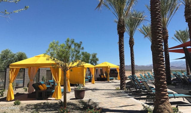 view of play area with a gazebo and a mountain view