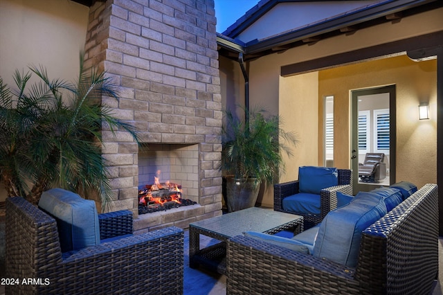 view of patio featuring an outdoor living space with a fireplace