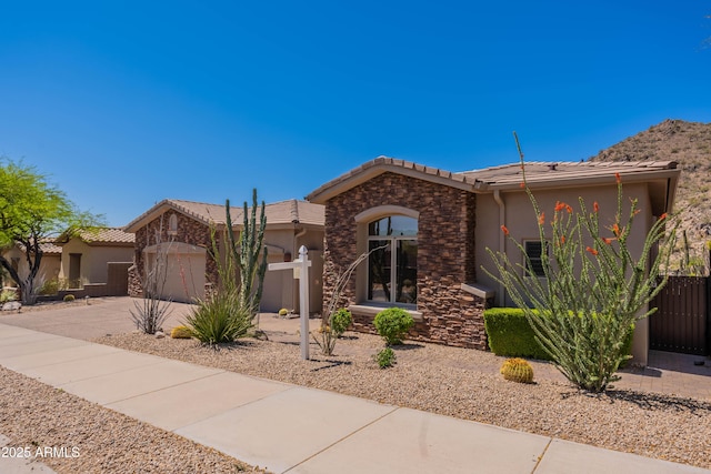 12770 N 145th Way, Scottsdale, AZ 85259 - view of front of home with a tiled roof, concrete driveway, and stucco siding