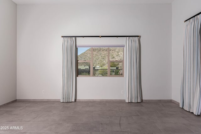 12770 N 145th Way, Scottsdale, AZ 85259 - spare room featuring baseboards
