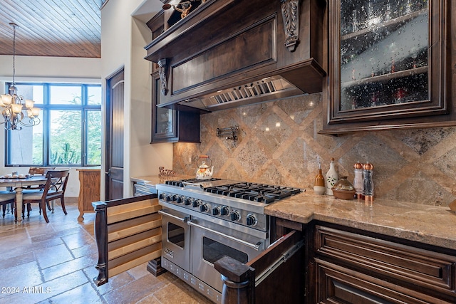 kitchen featuring pendant lighting, light stone counters, dark brown cabinets, and range with two ovens