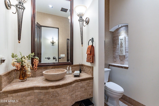 bathroom featuring sink and toilet