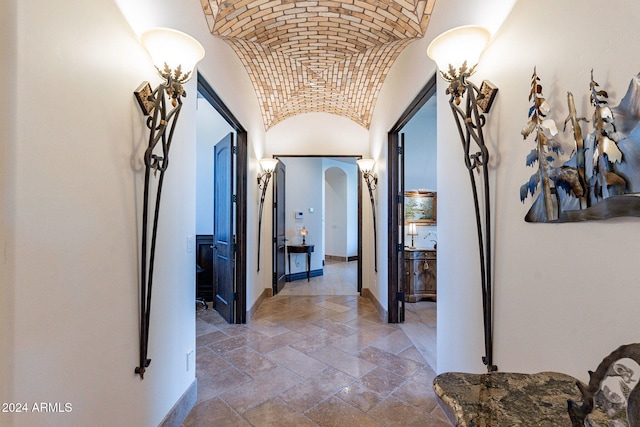 corridor with brick ceiling and vaulted ceiling