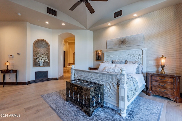 bedroom with high vaulted ceiling, light hardwood / wood-style floors, and ceiling fan