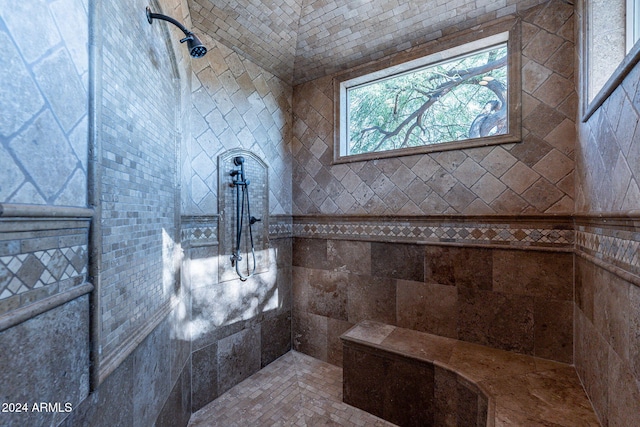 bathroom with tiled shower