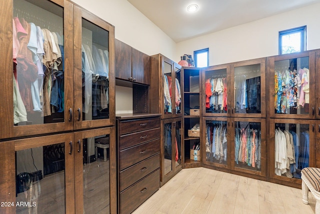 spacious closet featuring light hardwood / wood-style floors