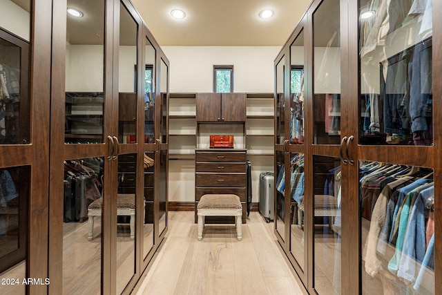 spacious closet featuring light hardwood / wood-style floors