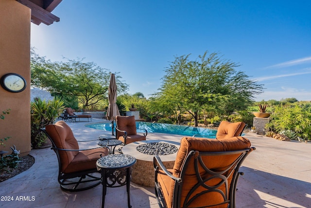 view of patio featuring an outdoor fire pit