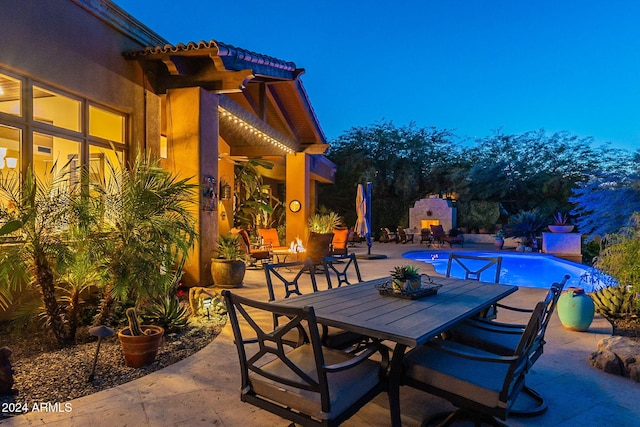 view of patio / terrace with an outdoor fireplace