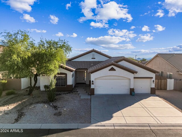 single story home featuring a garage