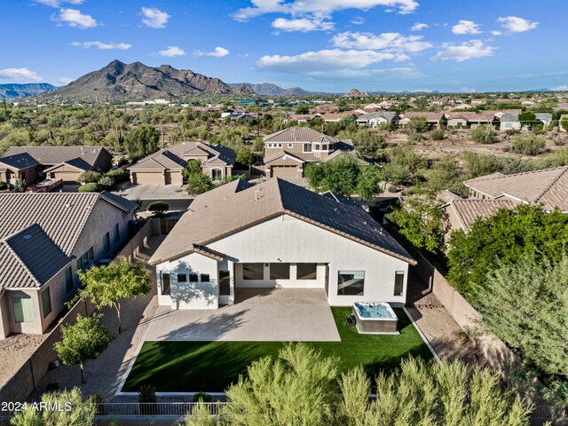 birds eye view of property featuring a mountain view